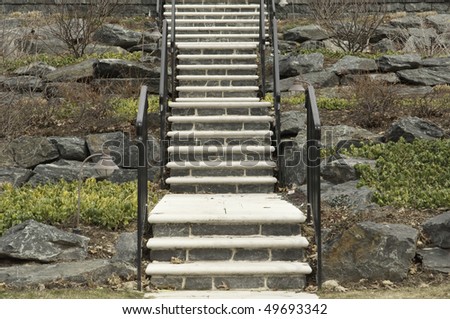Stone and concrete stairway up rocky hillside
