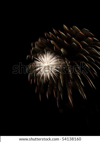 White-hot burst of fireworks inside reddish-yellow cloud of embers