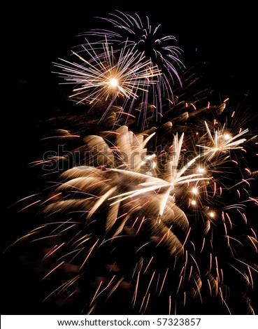 Variety of pyrotechnic effects during one moment of a fireworks display