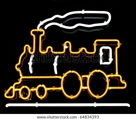 Neon sign of old-fashioned steam-powered locomotive and smoke in store window