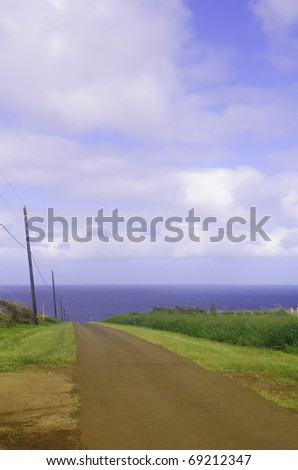Land, sea, and sky: One-lane dirt road to the ocean
