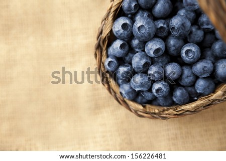 basket of fresh blueberries on jute