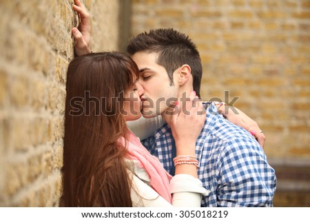 passionate kiss of two young people in love