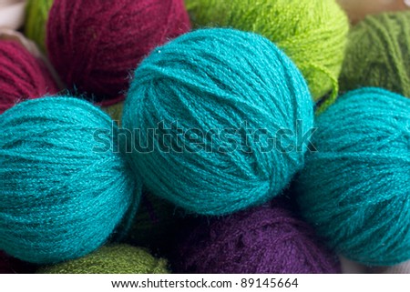 Balls of colored yarn. Multi-colored wool yarn in balls
