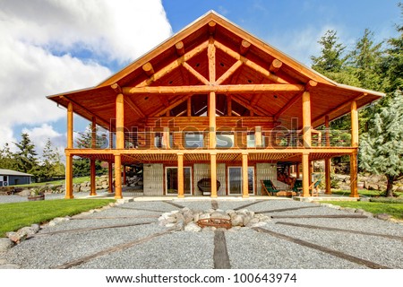 Large log cabin with large porch and fire circle