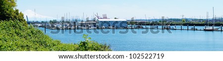 Mountain and port with boats. Puget Sound and Mt. Rainier. Port of Tacoma from Browns Point area( NE Tacoma). Panorama.