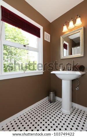 Classy Brown small bathroom with antique sink and tiles