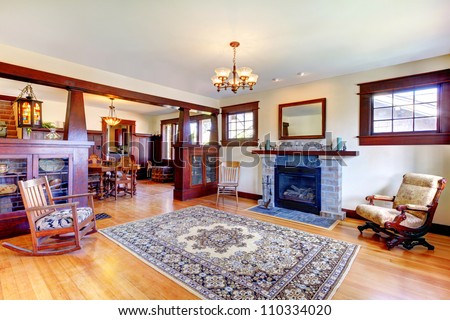 Beautiful old craftsman style home living room interior with fireplace.