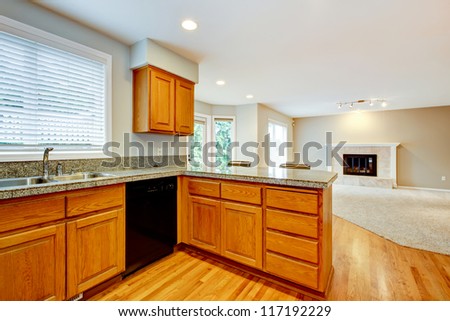 Large empty open new kitchen with living room house interior.