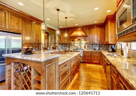 Mountain Luxury Home With Wood Kitchen And Granite Countertop.