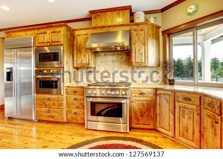 Wood luxury home kitchen interior. New Farm American home.