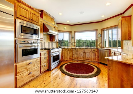 Wood luxury home kitchen interior. New Farm American home.