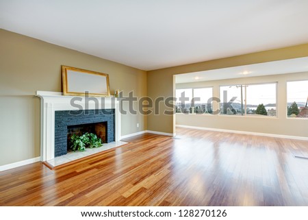 Living Room In A New Empty House With Fireplace, Hardwood Floor.
