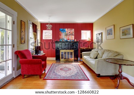 Living Room With Red And Yellow Walls And Fireplace In Old American House.