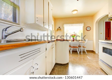 White old small kitchen interior in American house build in 1942.