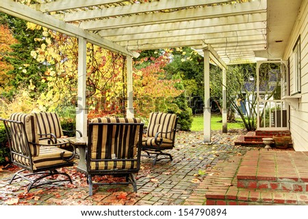 Fall Trees And Back Porch With Furniture.