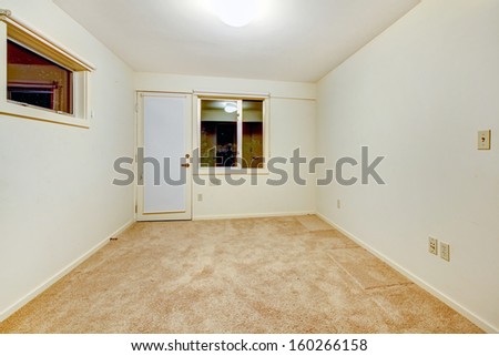 Empty bedrooms interiors with beige carpet. Guest house of luxury real estate. Night window view.