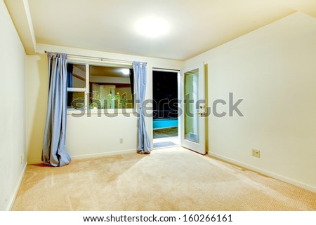 Empty bedrooms interiors with beige carpet. Guest house of luxury real estate. Night window view.
