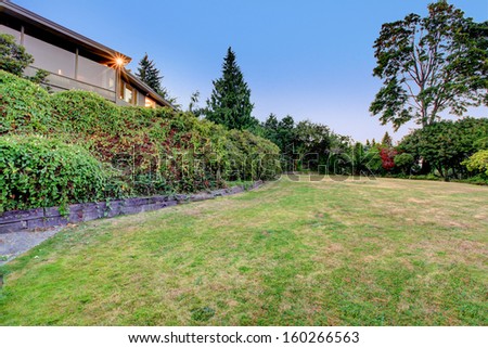 Large brown home with huge back yard. Luxury real estate exterior. Typical NorthWest home in US.