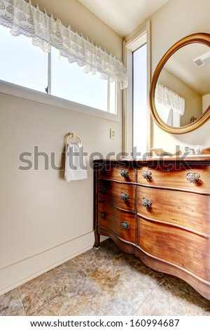 Old  antique simple bathroom interior with wood cabinet.