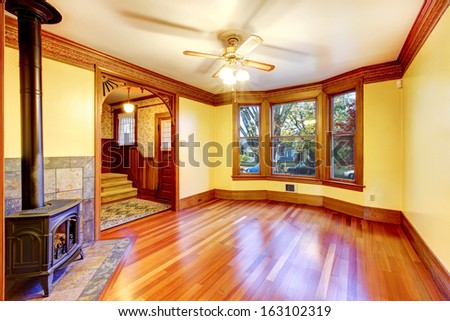 Empty Beautiful Living Room With Wood Burning Stove. Old American Craftsman Style Home With Lots Of Wood Details.