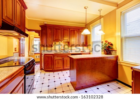Wood Kitchen With Yellow Walls. Old American Craftsman Style Home With Lots Of Wood Details.