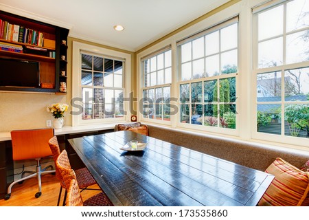 Bright Old Style Kitchen With Black Dining Table, Wicker Brown Chairs And Wide Windows