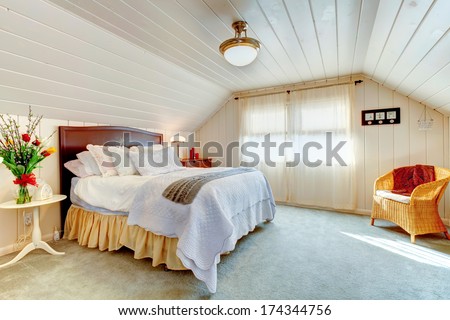 Cozy Bright Bedroom With Vaulted Ceiling And Light Blue Carpet Floor Decorated With Beautiful Flowers