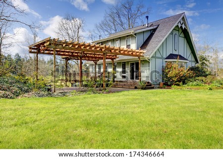 Designed Rustic Farmhouse With Open Front Deck And Attached Wood Pergola