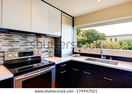 Black and white modern kitchen room with multi-color backsplash
