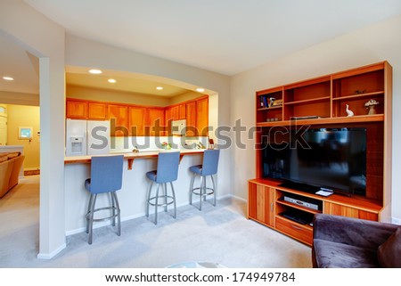 Cozy living room with wood cabinet and tv open top bright small kitchen room