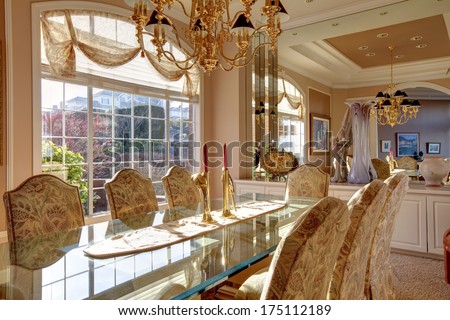 Rich dining room with wonderful dining table set and storage combination with big mirror