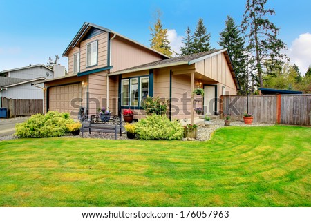 Beige siding house. Curb appeal