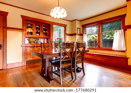 Bright Dining Room With Rustic Dining Table Set, Built-In Cabinets. Table Decorated With Fresh Flower.