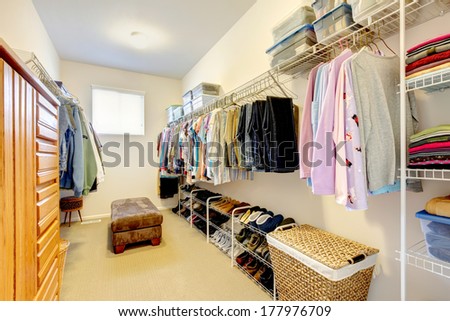 Big Walk-In Closet With Shelves For Clothes And Shoes, Dresser And Wicker Baskets