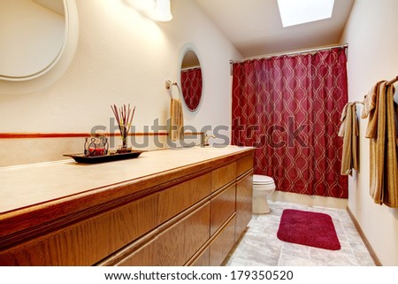 Farm house large bathroom with brown storage combination, red soft rug, red curtains