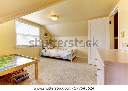 Yellow vaulted ceiling room with carpet floor. Furnished with wooden bed, table and dresser