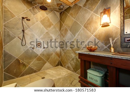 Concrete castle style bathroom with cherry washbasin cabinet, copper sink and faucet, open shower