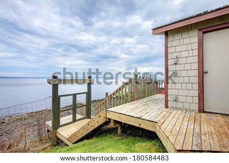 Waterfront beach boat house storage shed with winter Port Ludlow Beach.