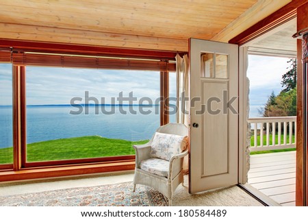 Floor-to-ceiling window with an amazing view. Bedroom with a walkout deck.