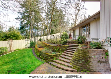 Beautiful backyard terrace deck with stairs.
