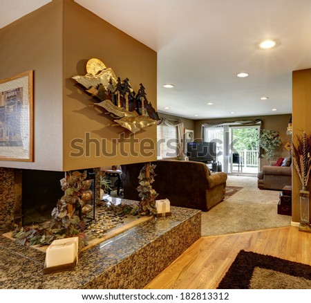 House interior. View of decorated with a metal art fireplace on a marble base