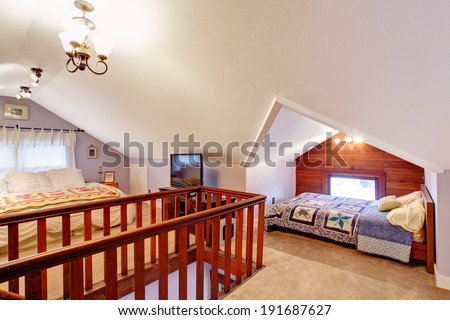 Bedroom with vaulted ceiling and carpet floor.