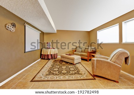 Entertainment room with love seat, ottoman, armchair and round table