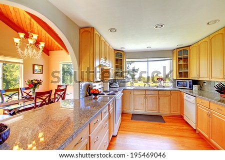 Beautiful kitchen interior with arch open wall to dining area
