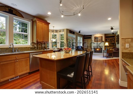 Open floor plan. View of elegant kitchen area with kitchen island