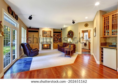 Cozy living room with fireplace and walkout deck