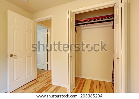 Small bedroom interior. CLose up view of empty closet