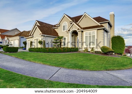Luxury house with small entrance porch, walkway and curb appeal