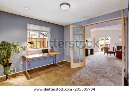 Office room interior in light lavender. Decorated with palm tree in the corner